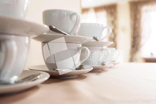 Image of Many cups on table,