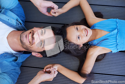 Image of Holding hands, floor portrait and relax happy family, children and dad smile for Fathers day, outdoor peace and connection. Solidarity, closeup and young kid, girl or youth child bonding with parent