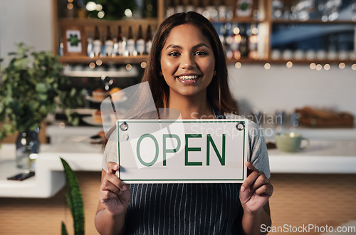 Image of Happy woman, open sign and portrait at cafe of small business owner or waitress for morning or ready to serve. Female person or restaurant server holding board for coffee shop or cafeteria opening