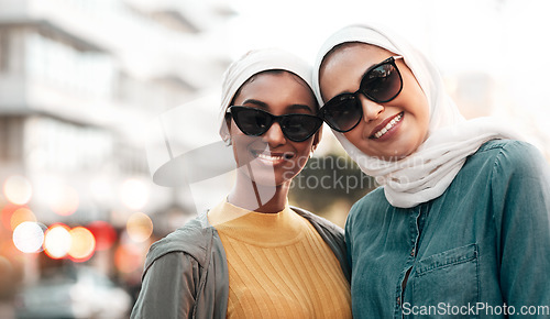 Image of Women friends, hijab and portrait in city with smile, sunglasses and support on street in Qatar. Islamic woman, together and freedom in metro with fashion, happy face and solidarity on travel