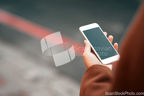 Image of Woman, hands and phone in city with mockup screen for travel, location or road side service. Hand of female person or traveler holding mobile smartphone app with display for copy space in urban town