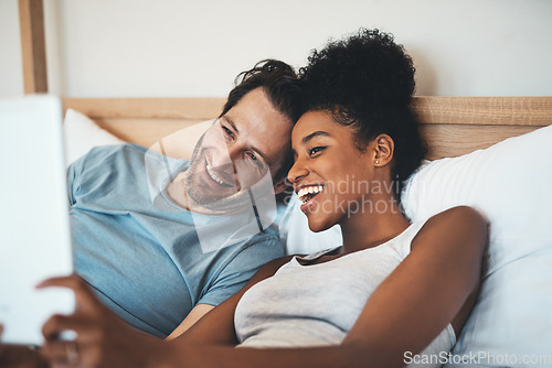 Image of Happy interracial couple, relax and bed for selfie, photo or social media post together at home. Man and woman person with smile for fun profile picture, morning or online vlog in bedroom at a house