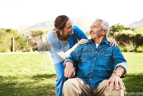 Image of Senior man, nurse and wheelchair for life insurance, healthcare support or garden at nursing home. Happy elderly male and woman caregiver helping patient or person with a disability in the outdoors