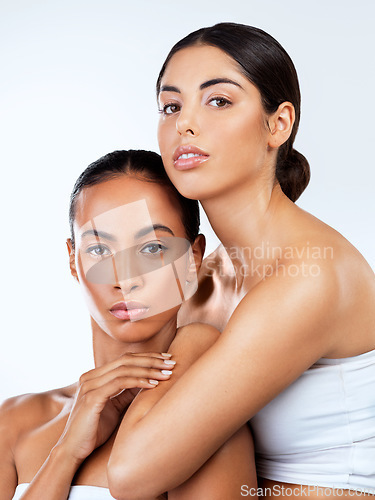 Image of Woman friends, studio portrait and cosmetic for skin, beauty or wellness by white background. Isolated model women, skincare or together for solidarity, healthy or natural glow on face with makeup