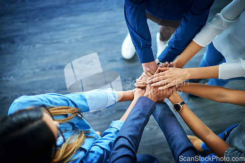 Image of Top view, business and group with hands together, support and collaboration with teamwork, partnership and goals. Staff, team and coworkers with brainstorming, target and innovation with cooperation