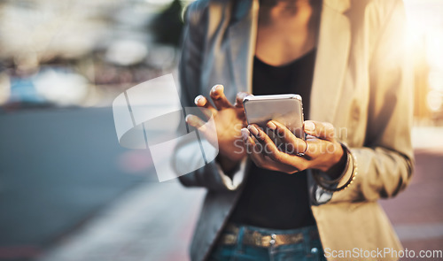 Image of Business woman, hands and phone in city networking, social media or texting outdoors. Hand of female professional chatting on mobile smartphone for communication or browsing in street of urban town