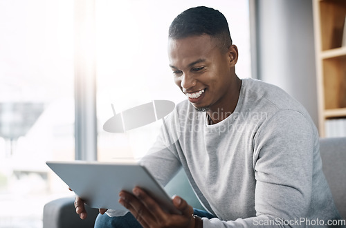 Image of Smile, tablet and happy man on couch reading social media meme, email or streaming video on subscription service. Happiness, internet and networking, person on sofa checking online movie website.