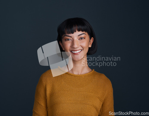 Image of Woman with smile in portrait, happy and confident with young person isolated on blue background. Youth, gen z and female model in studio with mockup space, positive mindset and happiness