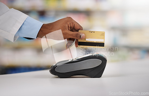 Image of Man, hand and pharmacist with credit card on machine for payment, purchase or swipe in checkout at pharmacy. Hands of person, medical or healthcare expert paying on pos system at pharmaceutical store