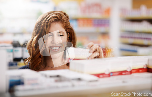 Image of Happy woman, shopping and pharmacy on shelf for pills, medication or drugs for healthcare at store. Female person, customer or patient checking pharmaceutical products, medicine or stock at a clinic