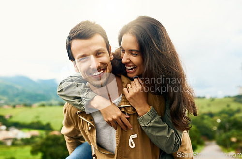 Image of Happy, love and piggyback with couple in nature for happy, smile and bonding. Happiness, relax and care with portrait of man carrying woman on countryside date for spring, vacation and support