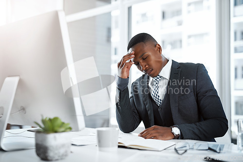 Image of Black man in business, headache and stress in workplace with corporate burnout, depression and pain in office. Male professional at desk, migraine and tired, overworked with anxiety and work crisis