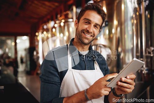 Image of Tablet, beer and brewery with portrait of man for production, manufacturing and alcohol fermentation. Technology, inspection and digital with business owner for distillery, storage or quality control