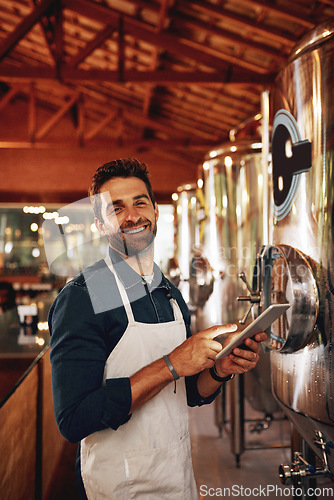 Image of Tablet, beer and portrait with man in factory for production, manufacturing and alcohol fermentation. Technology, inspection and digital with business owner for distillery, storage or quality control