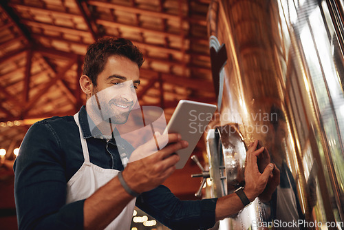 Image of Tablet, beer and storage with man in factory for production, manufacturing and alcohol fermentation. Technology, inspection and digital with business owner for distillery, brewery and quality control