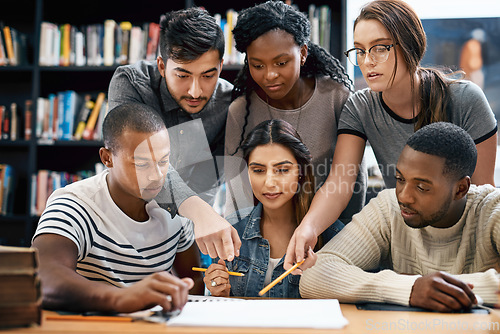 Image of People, students in library and studying for exam or research for project, education and teamwork. Diversity, young men and women in study group and learning with collaboration on university campus