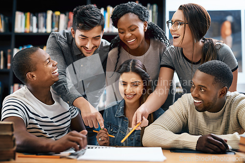 Image of Students laughing in library, studying together for exam or research for project, education and teamwork. Diversity, funny and young men with women in study group, learn together and happy on campus