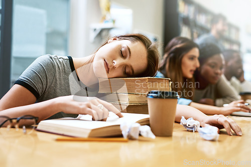 Image of Woman, sleeping and books for studying at library, college and tired with stress, anxiety or burnout. University student, girl and sleep with education, study and fatigue with notes, school and desk