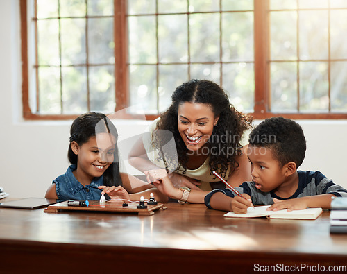 Image of Education, mother and helping her children with their homework or sitting on table or writing and drawing at home. Teaching, learning and mom with kids doing school task or reading for boy and girl