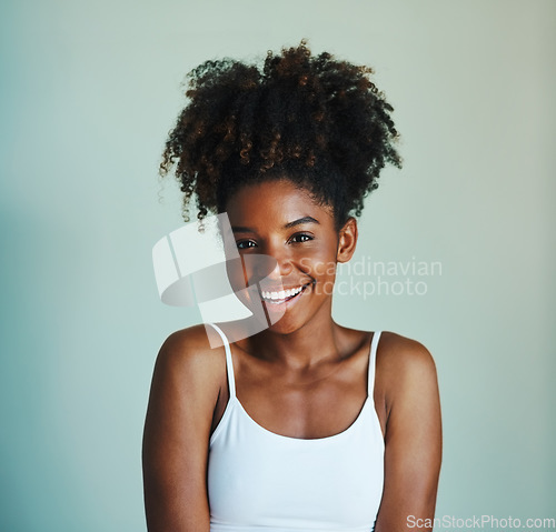 Image of Happiness, youth and portrait of black woman on studio background with afro, smile and skincare. Beauty, dermatology and happy African girl, model with mockup, natural cosmetics and beautiful face.