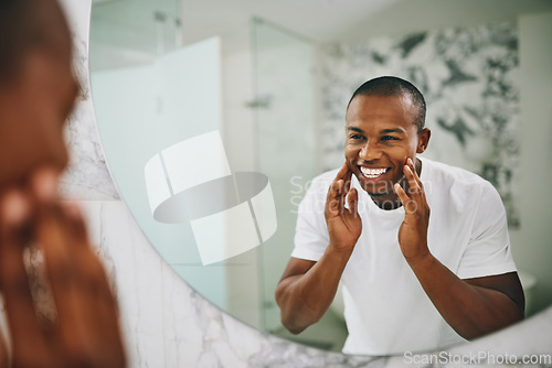 Image of Happy, morning and mirror with black man in bathroom for beauty, skincare and grooming. Cleaning, hygiene and self care with reflection of male person at home for facial, natural and wellness