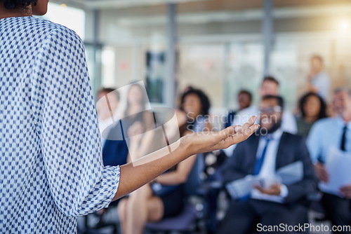 Image of Presentation, hand and a woman as speaker at a conference for training or workshop. Business, corporate and a female manager speaking to a crowd at a seminar or convention for leadership or mentoring