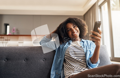 Image of Relax, black woman with remote and watching tv on sofa in living room of her home. Entertainment or comfort, streaming movie or a series and happy African female person watch television on a couch