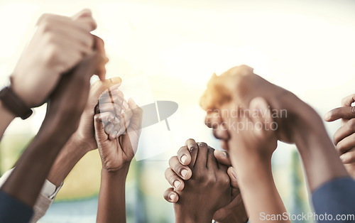 Image of Business, people, staff and group holding hands, solidarity and support with collaboration. Team, coworkers and partnership with cooperation, teamwork and goal with a target, growth and celebration