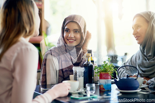 Image of Muslim women, friends and brunch in restaurant, together and talking with food, smile and discussion. Islamic woman, group and eating lunch with conversation, happy face and listen with food in cafe