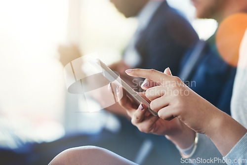 Image of Business woman, hand and phone in a meeting or conference while typing for notes or communication. Female entrepreneur in seminar or workshop audience with a smartphone for research or to check email