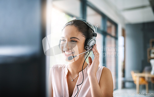 Image of Call center, customer support and female telemarketing agent working on an online consultation in office. Contact us, communication and woman consultant with a crm strategy with headset in workplace.