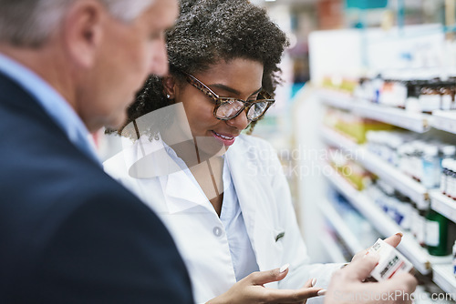 Image of Senior man, reading medicine or pharmacist in pharmacy for retail healthcare info, pills box or advice. Black woman or doctor helping a mature customer with prescription medication or medical drugs