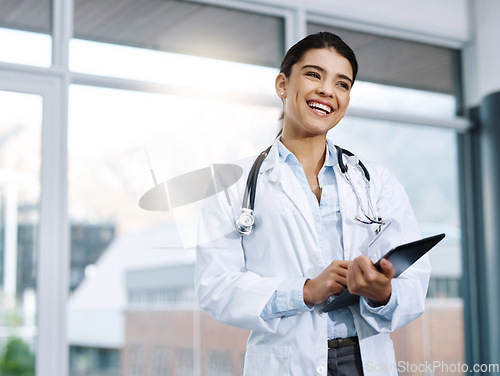 Image of Funny, doctor and woman with tablet in hospital for research, telehealth and healthcare. Technology, happiness and female medical professional with touchscreen for online wellness, app and thinking.