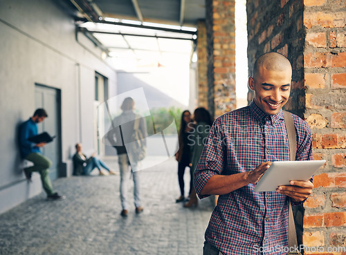 Image of Smile, outdoor and man with a digital tablet, campus and search website for information, connection and meme. Male person, guy and student with technology, typing and social media with communication