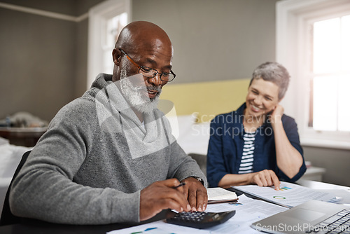Image of Calculator, documents or finance with an old couple busy on a budget review in the home together. Accounting, taxes or investment with a senior man and interracial woman planning insurance or savings