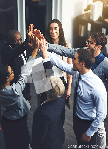 Image of Teamwork, high five and support with business people in office for success, winner and motivation. Collaboration, diversity and community with group of employees for solidarity, target and goals