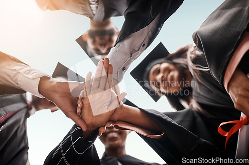 Image of Students, graduation and group with hands stacked for college celebration outdoor. Below diversity men and women together for university achievement, education success and school graduate event