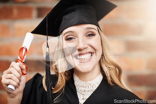 Image of Woman, graduation and portrait of a university student with a diploma and smile on face. Female person excited to celebrate college achievement, education success and future outdoor at school event