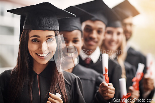 Image of Woman, graduation and portrait of a college group with a diploma and smile outdoor. Diversity men and women students celebrate university achievement, education success and future at school event