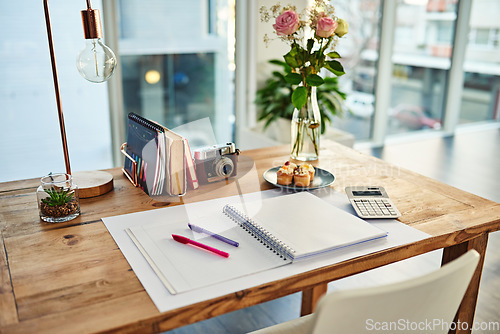 Image of Remote work, book and desk in creative workplace with paper for writing, planning and idea inspiration. Notebook, space and workspace table for freelance business in home office room for creativity