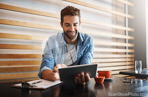 Image of Online, typing and a man with a tablet at a cafe for communication, connectivity and administration. Happy, remote work and a male entrepreneur reading from the web with technology at a coffee shop