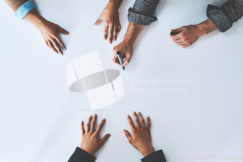 Image of Mockup, writing and business analyst team planning company growth strategy together as teamwork or collaboration. Brainstorming, discussion and hands of corporate people in a development meeting