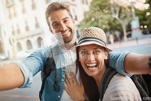 Image of Happy couple, tourist and selfie in a city for travel on street with holiday memory and happiness. Portrait of man and woman outdoor on urban road for adventure, social media or vacation photo