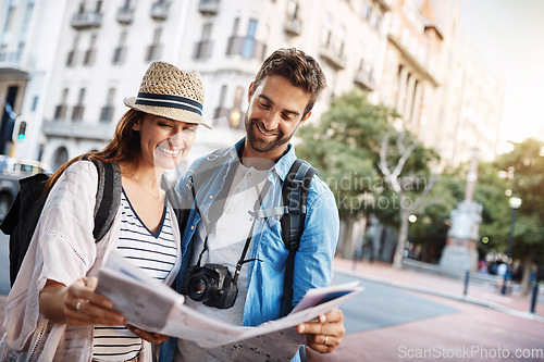 Image of Couple, tourist and a map in a city for travel on a street for direction or location search. Man and woman together with paper for navigation outdoor on urban road for adventure, journey or vacation