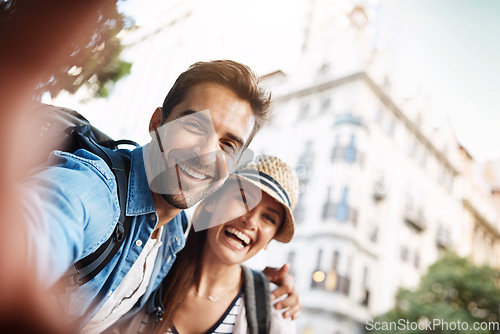 Image of Tourist couple, selfie and happy in a city for travel on a street with a partner for holiday memory. Face of a man and woman outdoor on urban road for adventure, journey or vacation photo for freedom