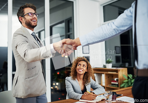 Image of Businessman, shake hand and meeting for an agreement and collaboration after sign contract. Professional, handshake and hiring during recruitment and a negotiation for a new worker in the company.