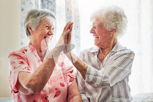 Image of Happy, love and senior women with a high five for care, retirement support and happiness. Smile, team and elderly friends with excited gesture for solidarity or lifestyle in a nursing home together