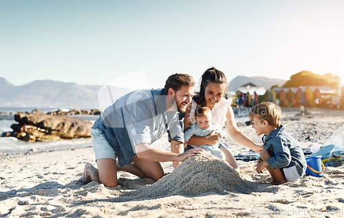 Image of Sandcastle fun, parents and children at the beach with bonding, love and support. Baby, mom and dad together with kids playing in the sun with happiness and smile by the ocean and sea with family