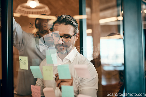 Image of Businessman, writing and schedule planning in meeting for strategy, brainstorming or tasks at office. Man employee in leadership, presentation or training staff in team project plan at the workplace