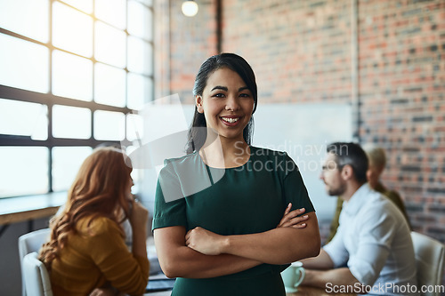 Image of Smile, portrait and business woman with arms crossed in company startup meeting. Face, confidence and happy female leader, professional and person with pride for career, job and success mindset.